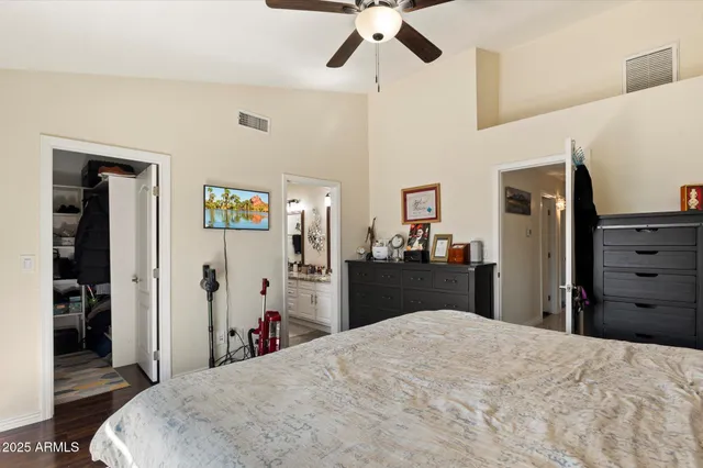 a bed room with a bed and dresser