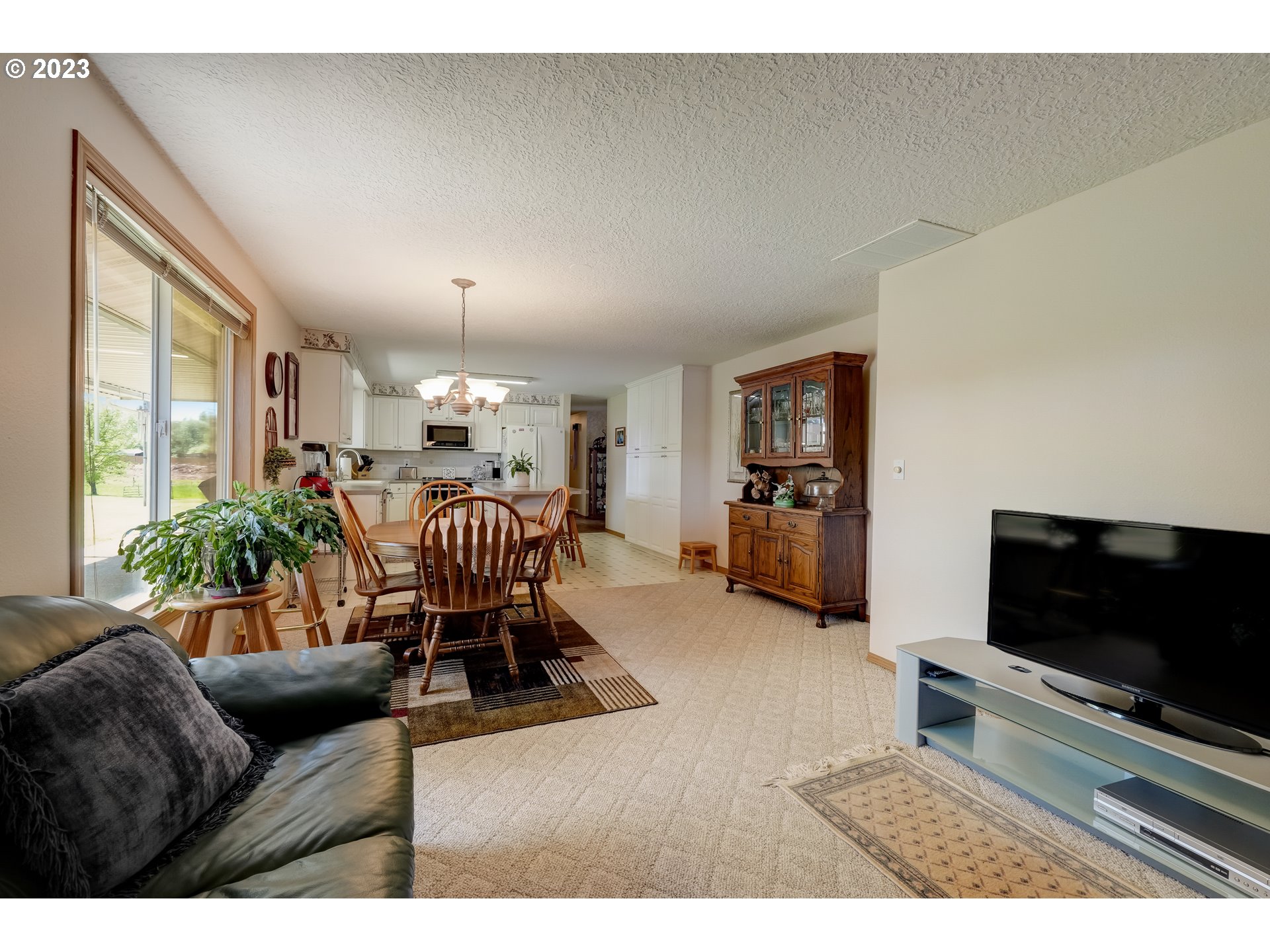 419 Northwest 189th Street Ridgefield, WA 98642 - Photo 8 of 39 a living room with furniture and a flat screen tv