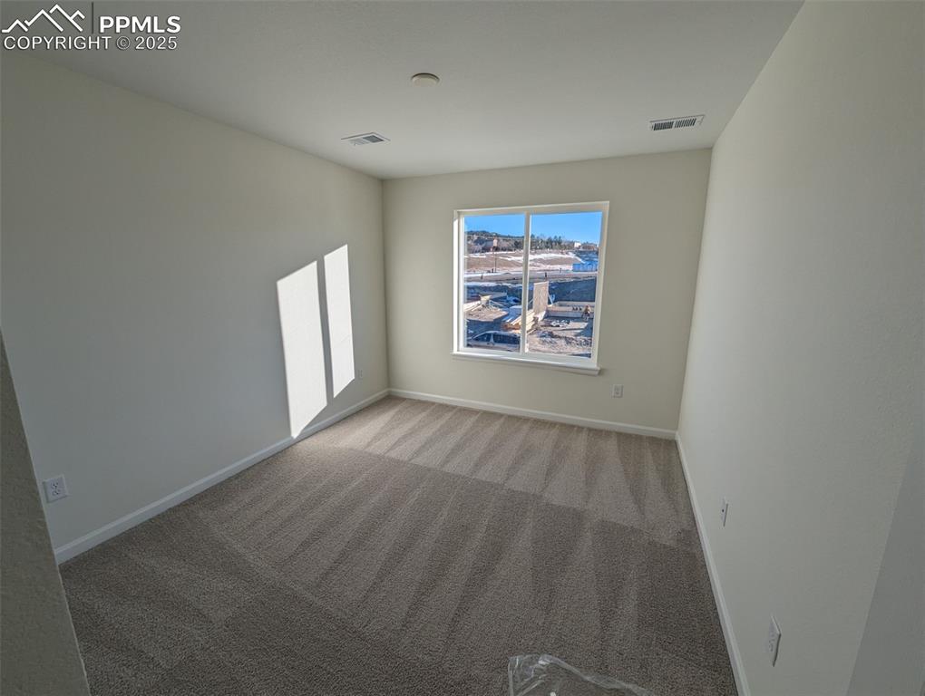 16966 Starfall Drive Monument, CO 80132 - Photo 13 of 18 an empty room with windows