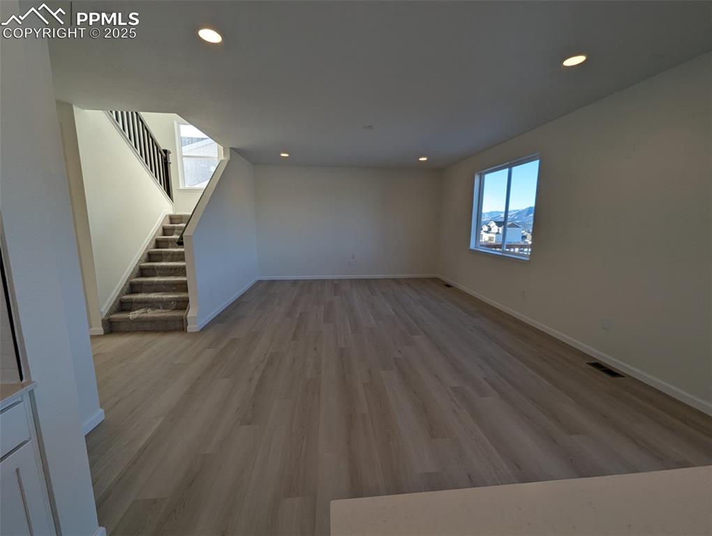 16966 Starfall Drive Monument, CO 80132 - Photo 4 of 18 wooden floor in an empty room with a window