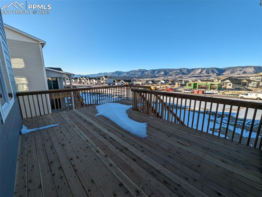 16966 Starfall Drive Monument, CO 80132 - Photo 5 of 18 a view of a roof deck with wooden floor and fence