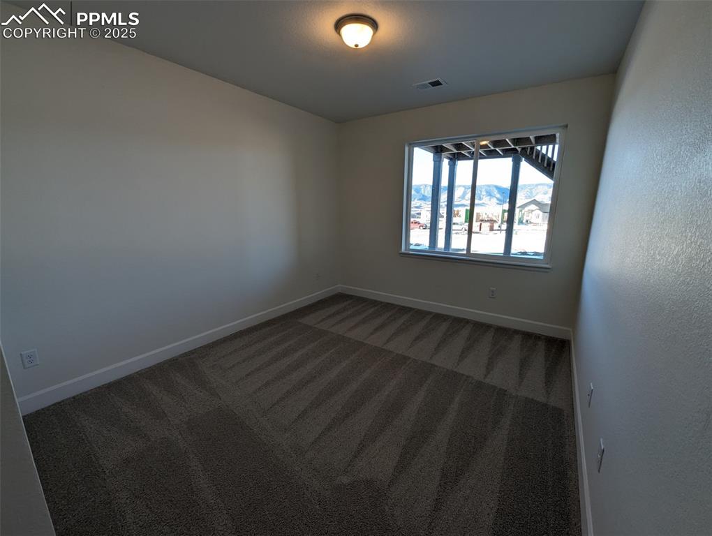 16966 Starfall Drive Monument, CO 80132 - Photo 8 of 18 an empty room with a window