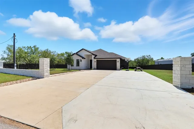 a white house with a yard