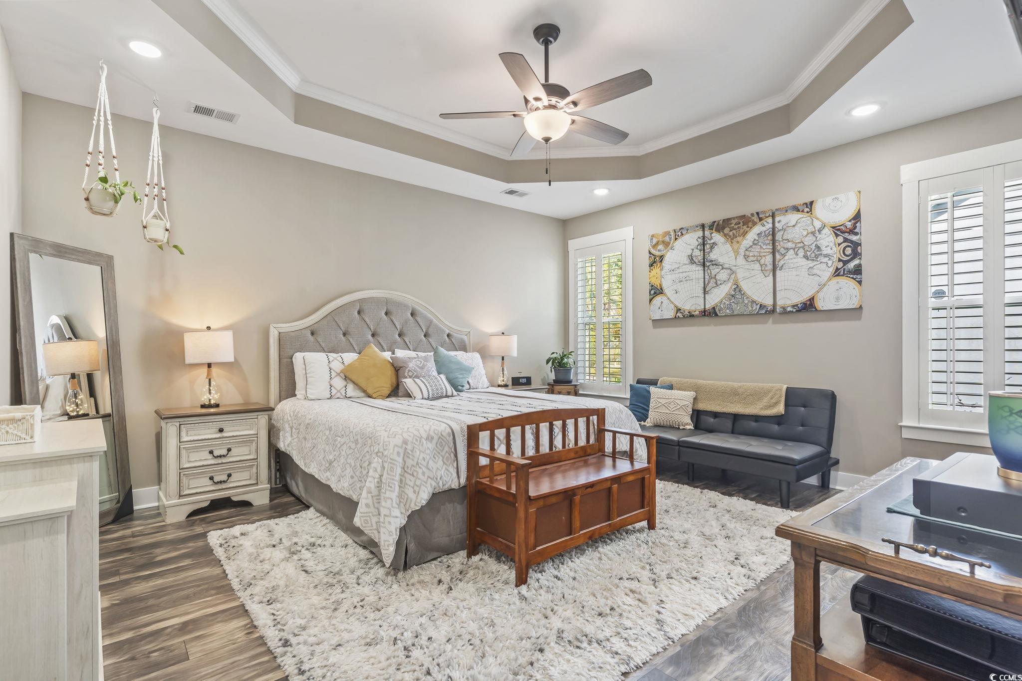 175 Rivers Edge Drive Conway, SC 29526 - Photo 16 of 37 Bedroom featuring ornamental molding, a tray ceiling, dark wood-style flooring, recessed lighting, and a ceiling fan
