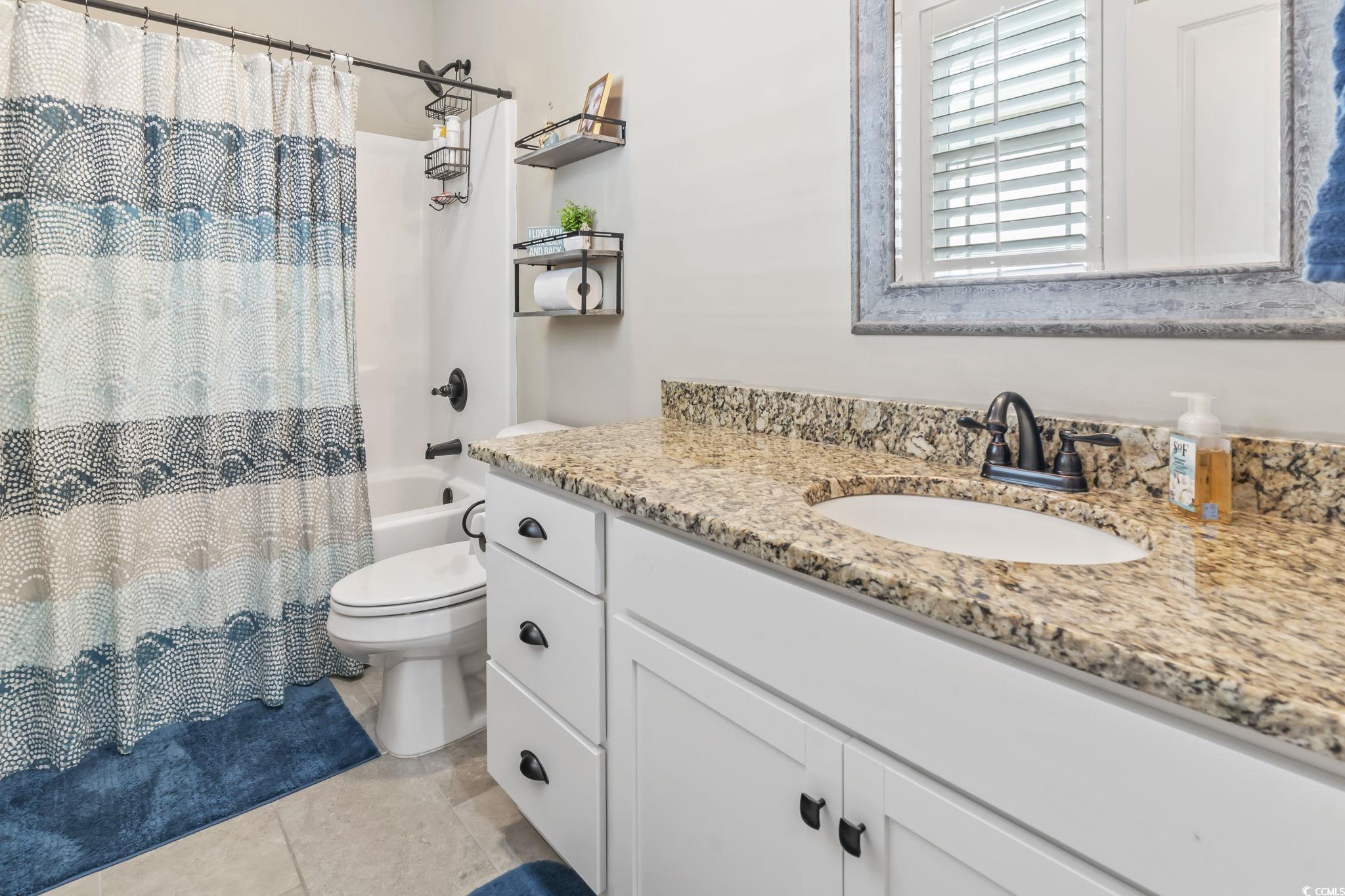 175 Rivers Edge Drive Conway, SC 29526 - Photo 25 of 37 Bathroom with vanity, shower / bathtub combination with curtain, and light tile patterned floors