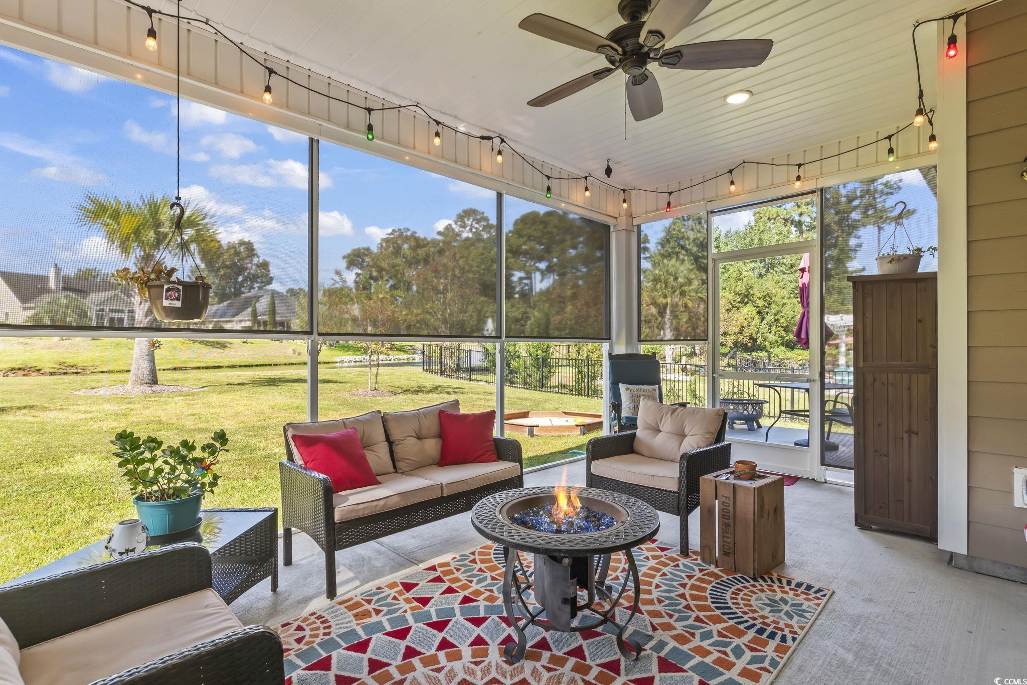 175 Rivers Edge Drive Conway, SC 29526 - Photo 27 of 37 Sunroom with an outdoor living space with a fire pit and a ceiling fan