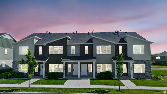 1221 West 1870 South Logan, UT 84321 - Photo 1 of 20 Modern multi-unit residence featuring a stone veneer facade, dark shingle roofing, and contemporary siding