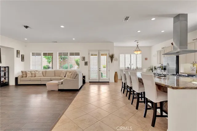 a dining table with chairs and window