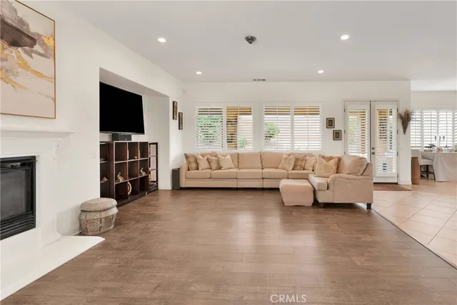 a bedroom with a large bed and a flat screen tv