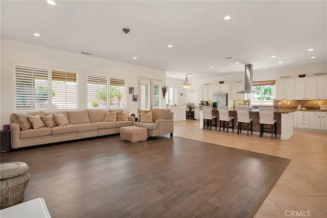 a spacious bathroom with a tub sink and mirror