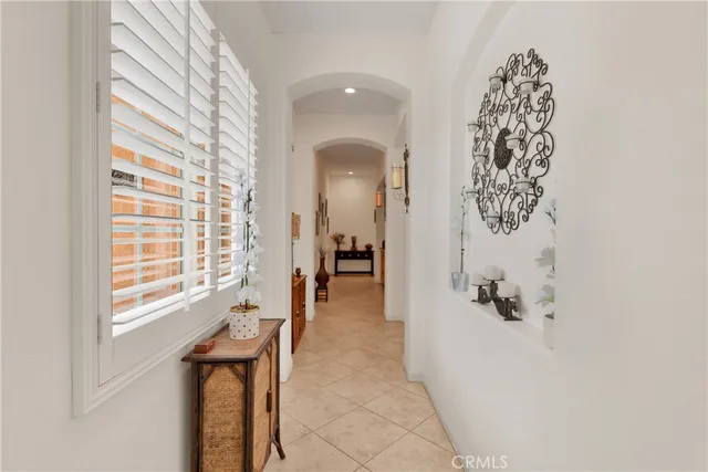 a kitchen with stainless steel appliances a sink dishwasher refrigerator stove and cabinets