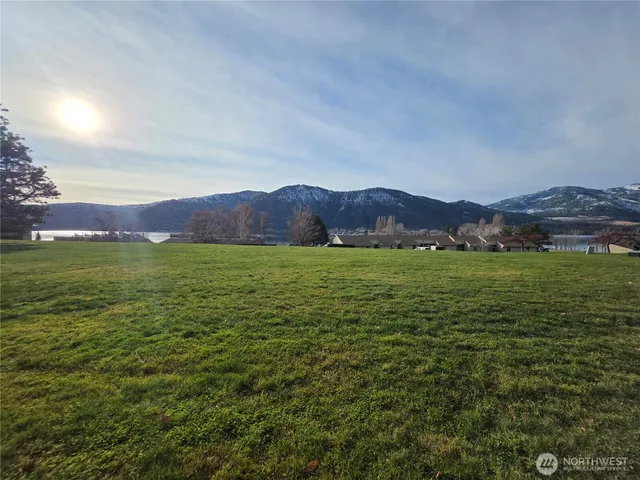 a view of an ocean and mountains