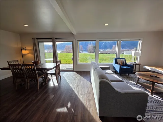 a view of a dining room with furniture window and outside view