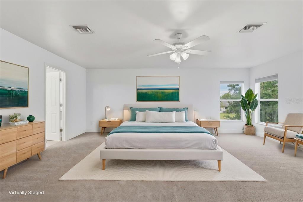 25134 Palisade Road Punta Gorda, FL 33983 - Photo 42 of 58 a bedroom with a bed couch and windows