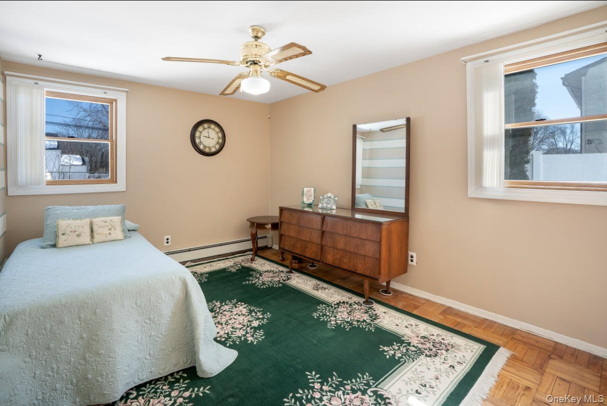 69 Riviera Drive Selden, NY 11784 - Photo 16 of 20 a bedroom with a bed and a window