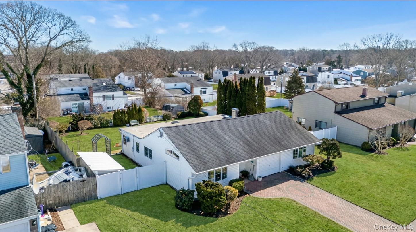 69 Riviera Drive Selden, NY 11784 - Photo 19 of 20 a view of a city from a terrace