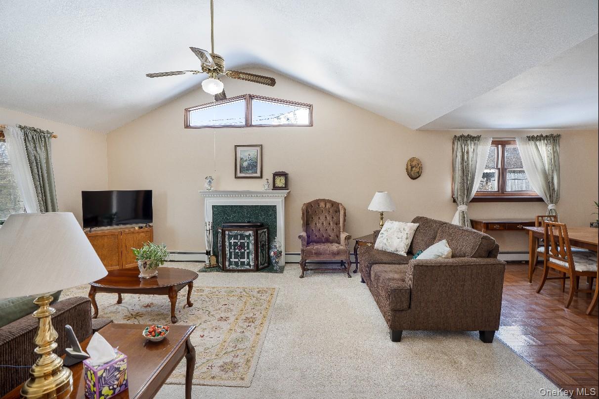 69 Riviera Drive Selden, NY 11784 - Photo 5 of 20 a living room with furniture and a fireplace