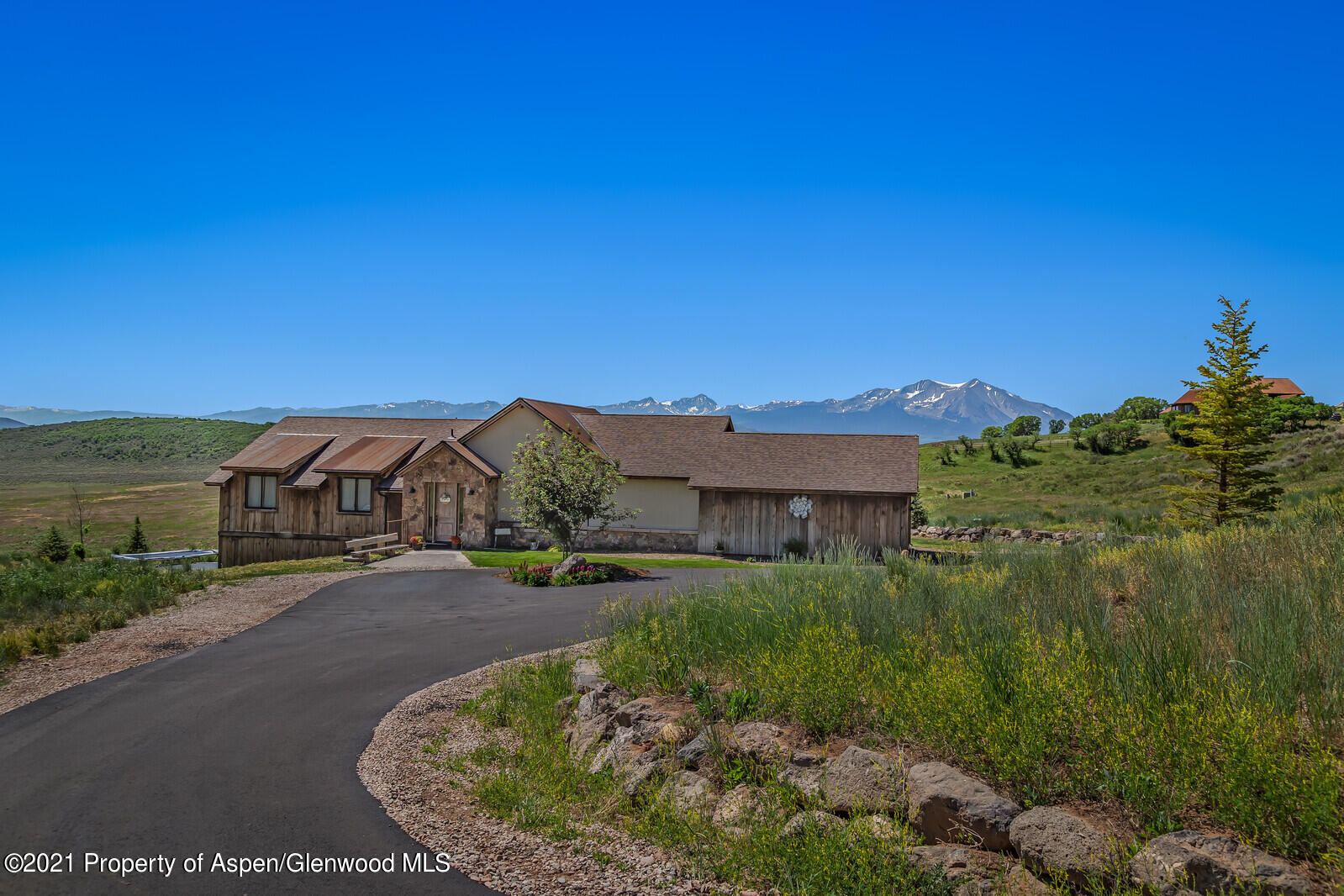 a view of a street with a building in the background