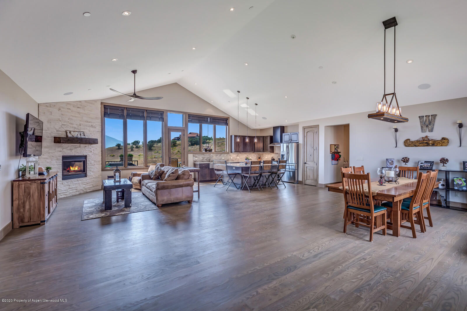 1009 Cattle Creek Ridge Road Carbondale, CO 81623 - Photo 13 of 40 a living room with furniture and a wooden floor