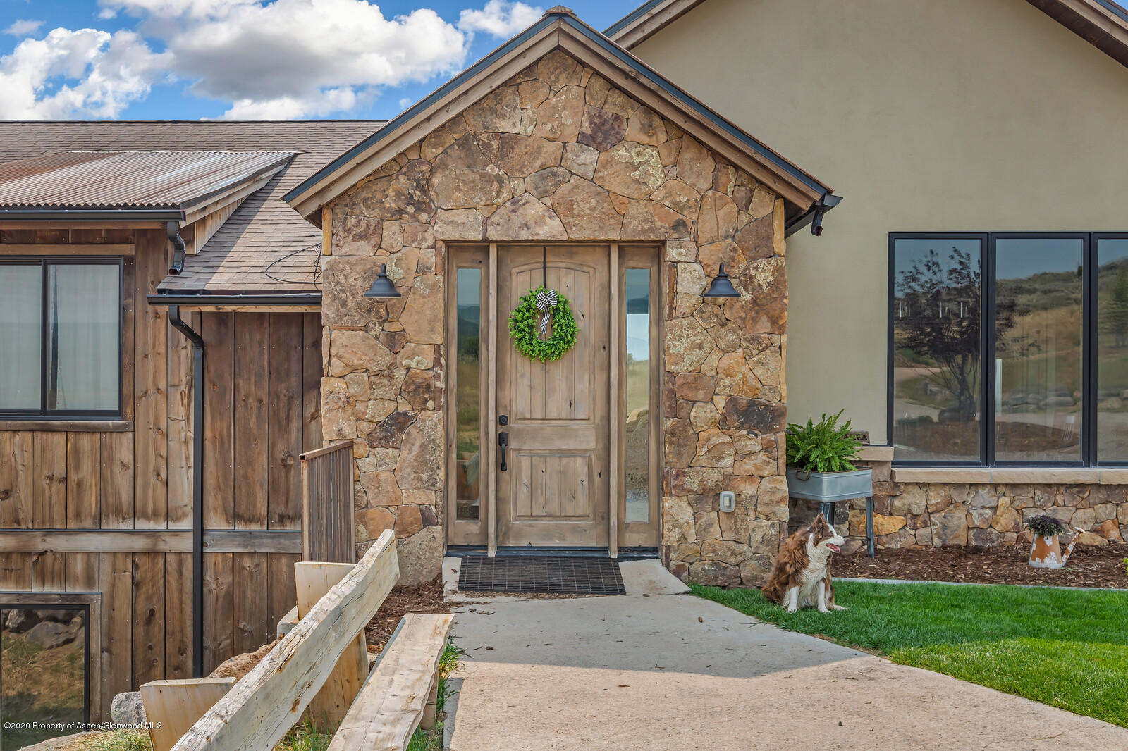 1009 Cattle Creek Ridge Road Carbondale, CO 81623 - Photo 2 of 40 a front view of a house with garden