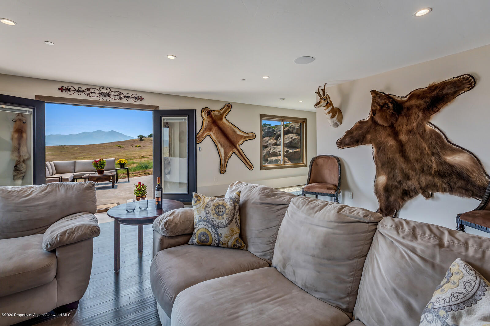 1009 Cattle Creek Ridge Road Carbondale, CO 81623 - Photo 21 of 40 a living room with furniture and a flat screen tv