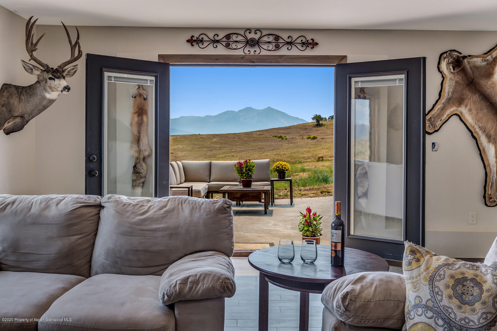 1009 Cattle Creek Ridge Road Carbondale, CO 81623 - Photo 22 of 40 a living room with furniture and a floor to ceiling window