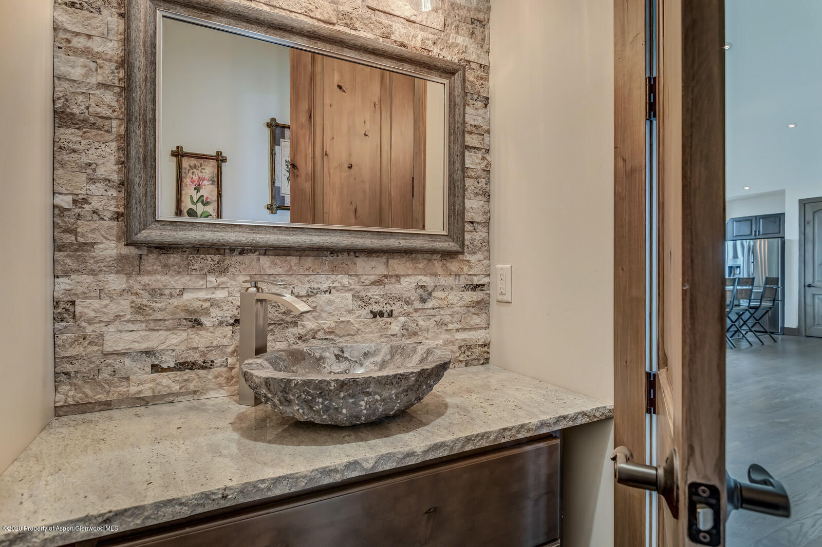 1009 Cattle Creek Ridge Road Carbondale, CO 81623 - Photo 24 of 40 a bathroom with a granite countertop sink and a mirror