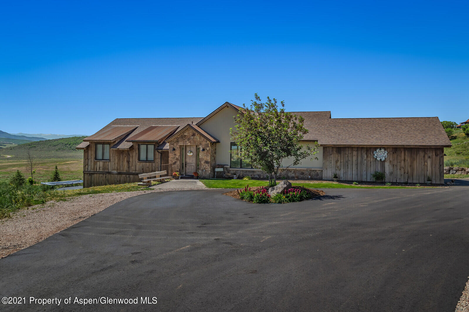 1009 Cattle Creek Ridge Road Carbondale, CO 81623 - Photo 29 of 40 a view of a house with a yard and sitting area