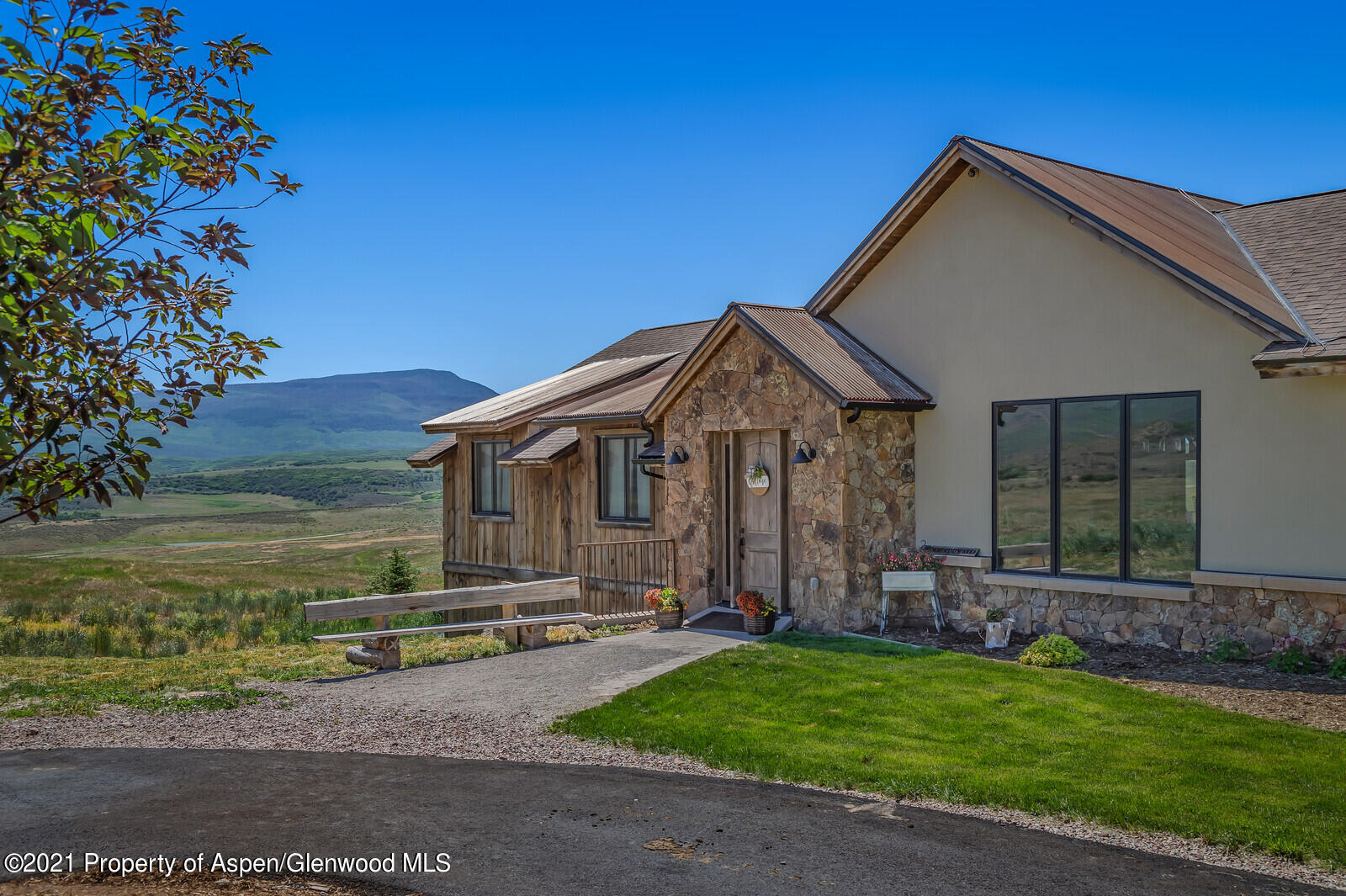 1009 Cattle Creek Ridge Road Carbondale, CO 81623 - Photo 31 of 40 a front view of a house with garden