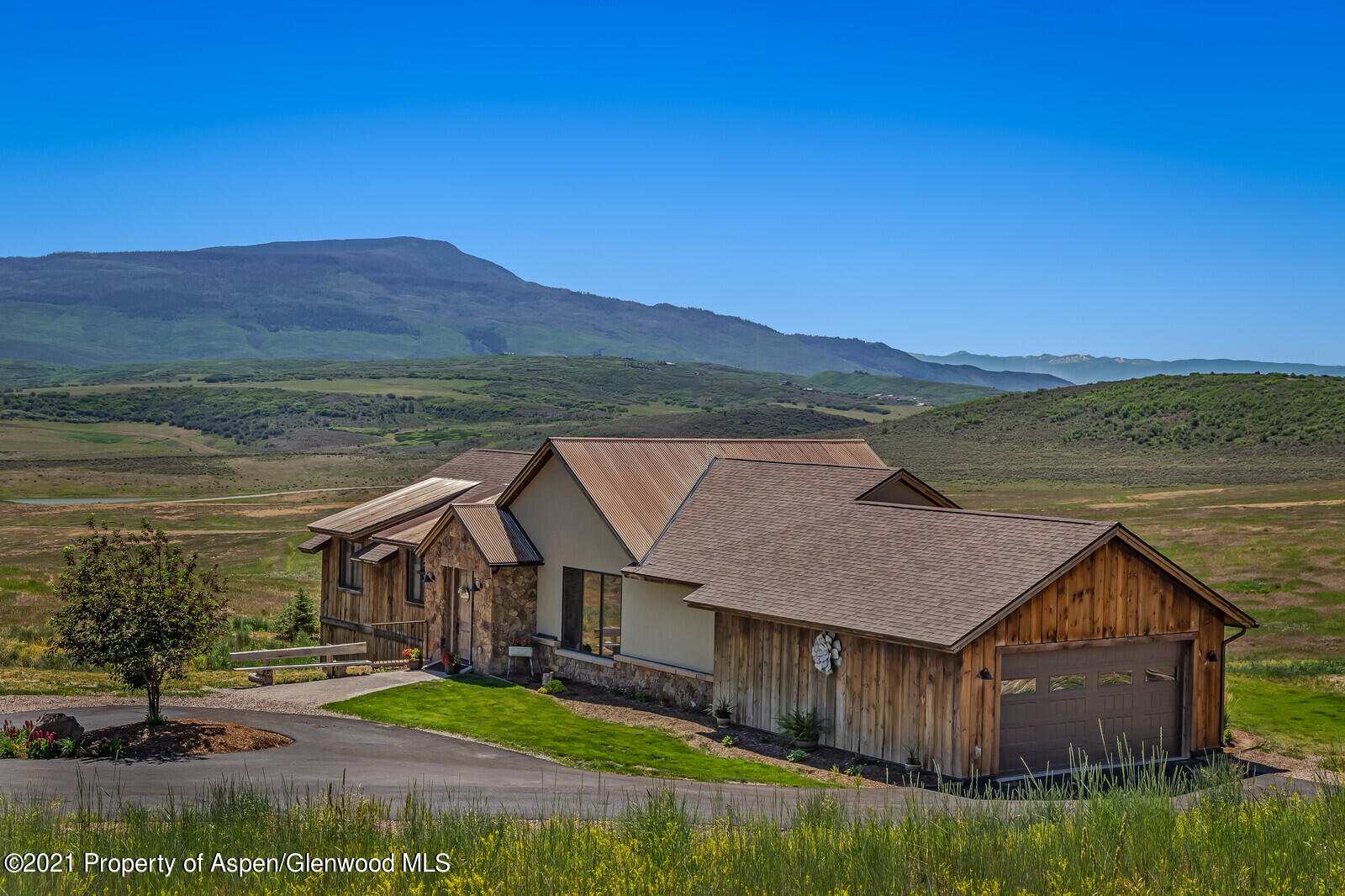 1009 Cattle Creek Ridge Road Carbondale, CO 81623 - Photo 32 of 40 a view of a house with a yard