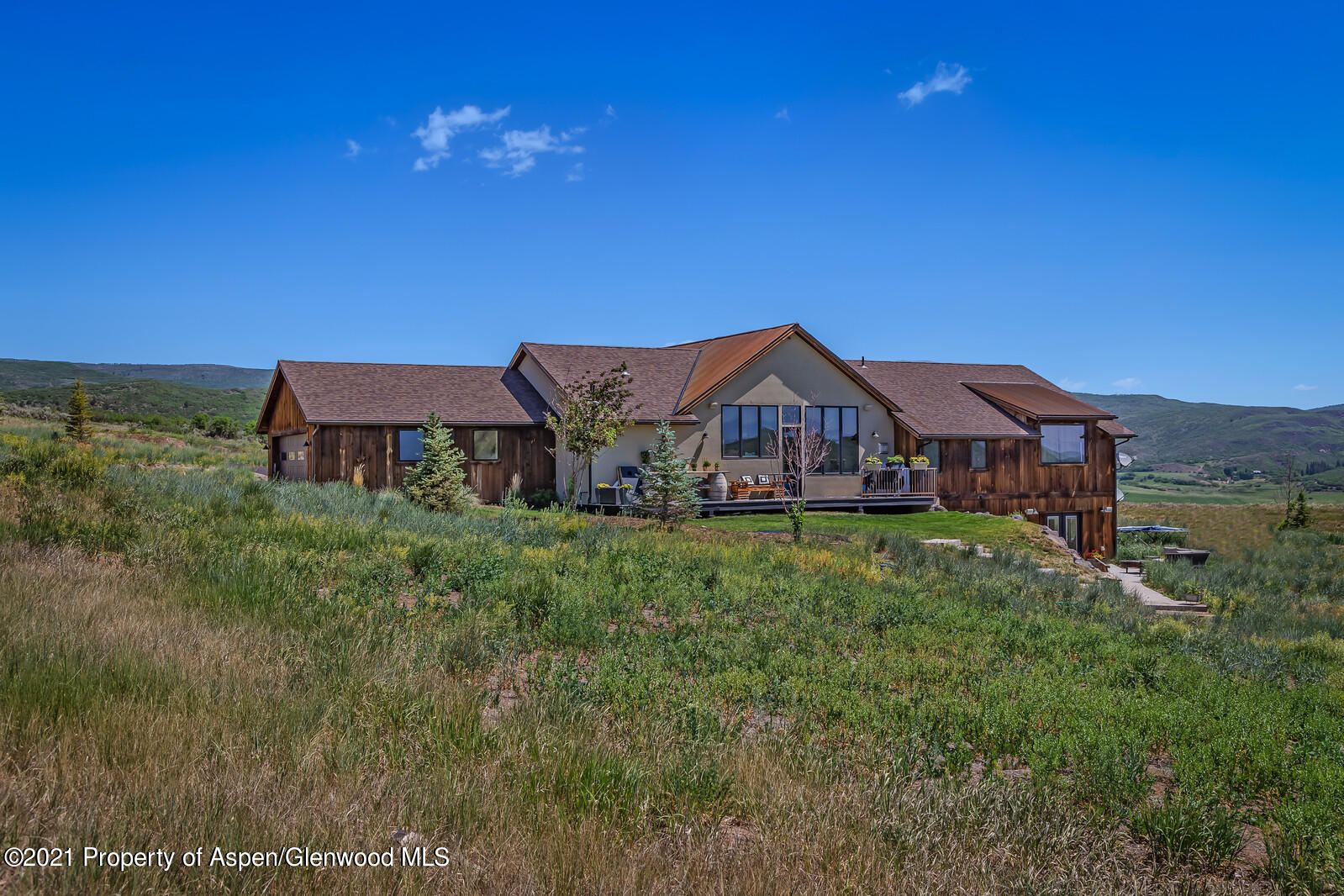 1009 Cattle Creek Ridge Road Carbondale, CO 81623 - Photo 35 of 40 a front view of a house with garden
