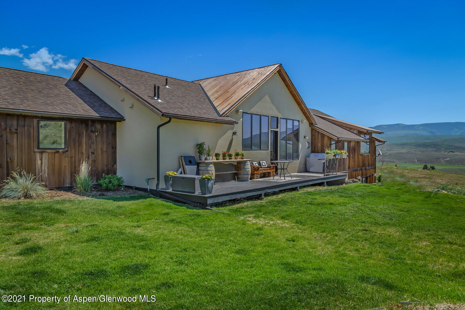 1009 Cattle Creek Ridge Road Carbondale, CO 81623 - Photo 38 of 40 a view of a house with a yard porch and sitting area