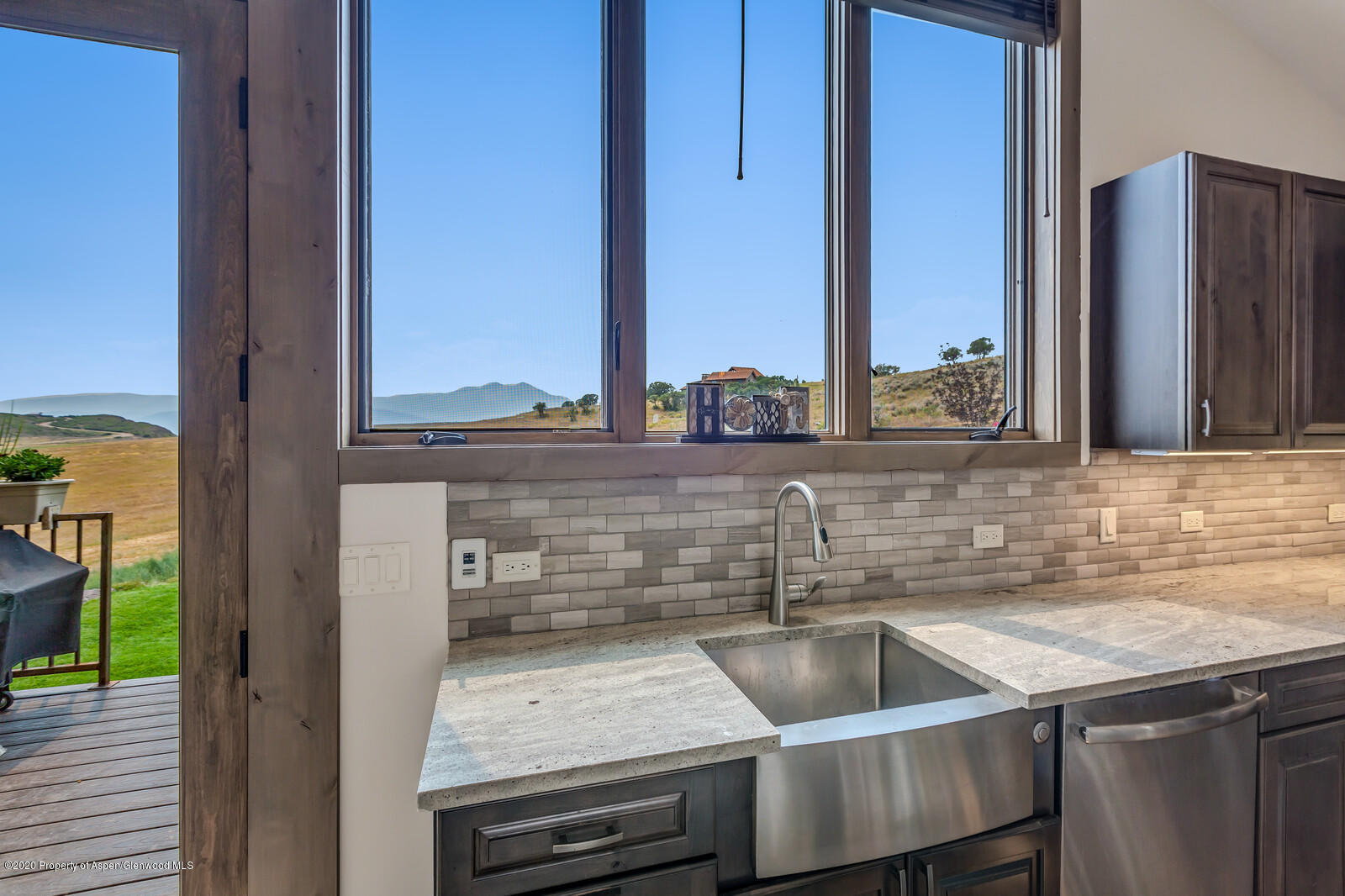 1009 Cattle Creek Ridge Road Carbondale, CO 81623 - Photo 5 of 40 a kitchen with a sink and a refrigerator
