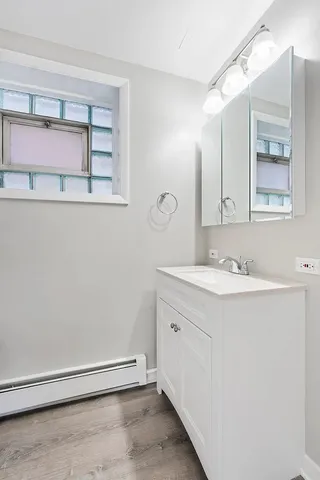 a bathroom with a sink and a mirror
