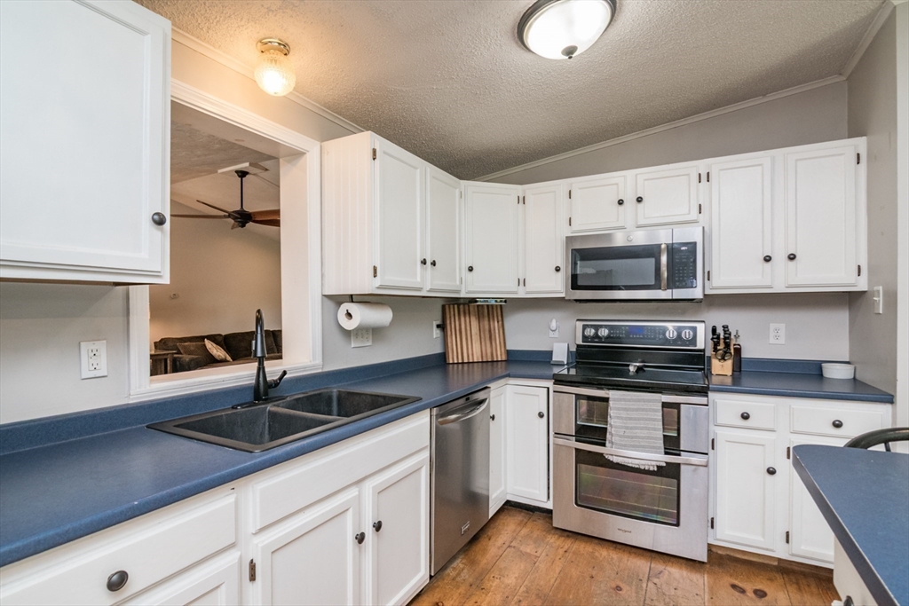 183 Millers Falls Road Montague, MA 01376 - Photo 12 of 33 a kitchen with cabinets a sink and appliances