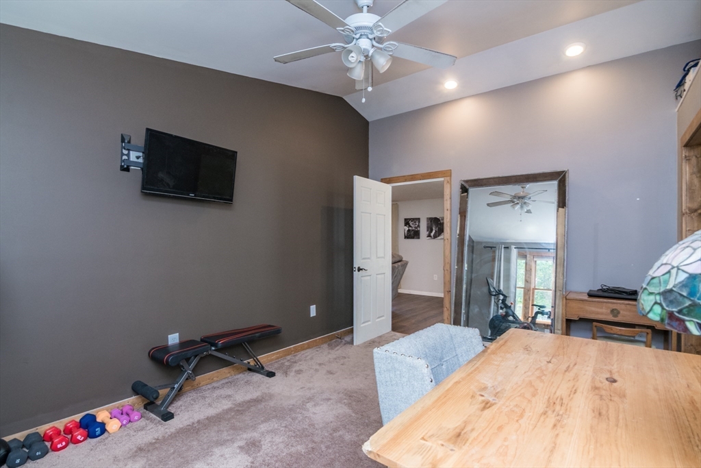 183 Millers Falls Road Montague, MA 01376 - Photo 24 of 33 a bedroom with a bed and a flat screen tv