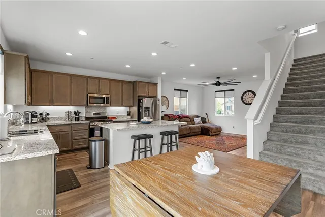 a kitchen with counter space dining table and appliances