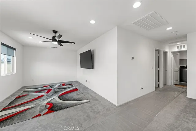 a room with furniture and a flat screen tv