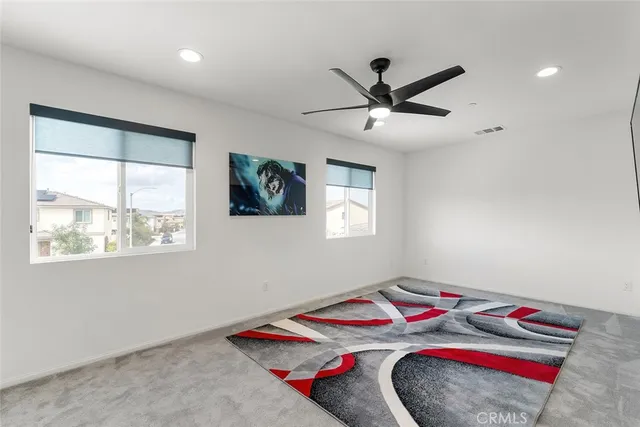 a bedroom with bed and a window