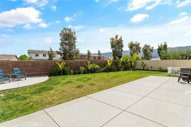 a view of backyard with seating space