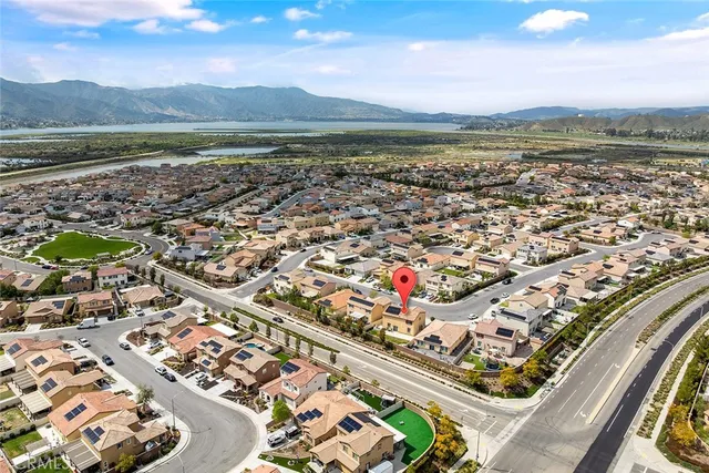 an aerial view of residential houses with outdoor space