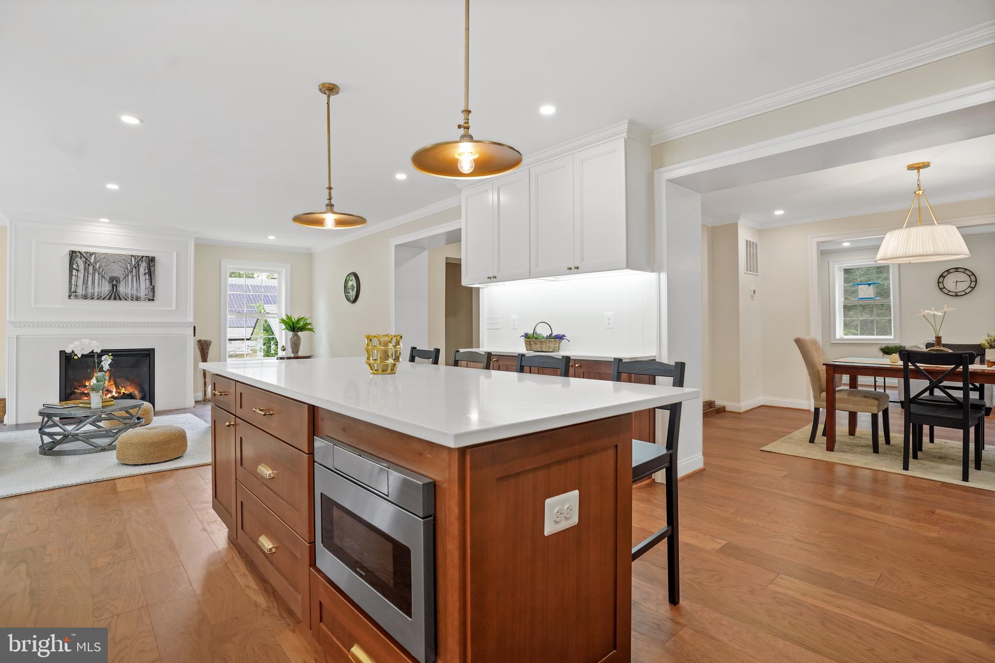 3722 13th Street Northeast Washington, DC 20017 - Photo 11 of 50 a kitchen with stainless steel appliances granite countertop a stove and a wooden floors