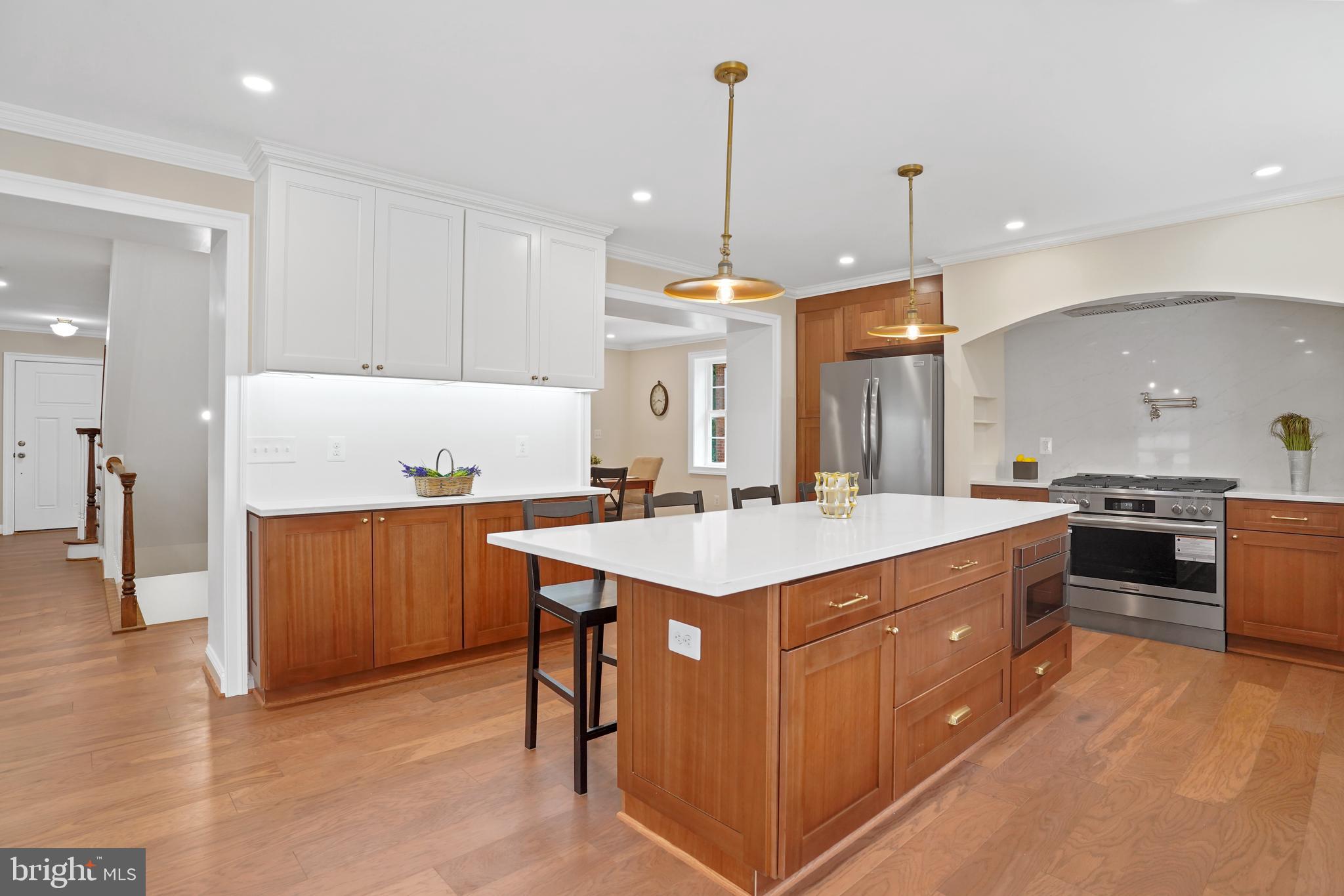 3722 13th Street Northeast Washington, DC 20017 - Photo 14 of 50 a kitchen with a sink a counter top space appliances and cabinets