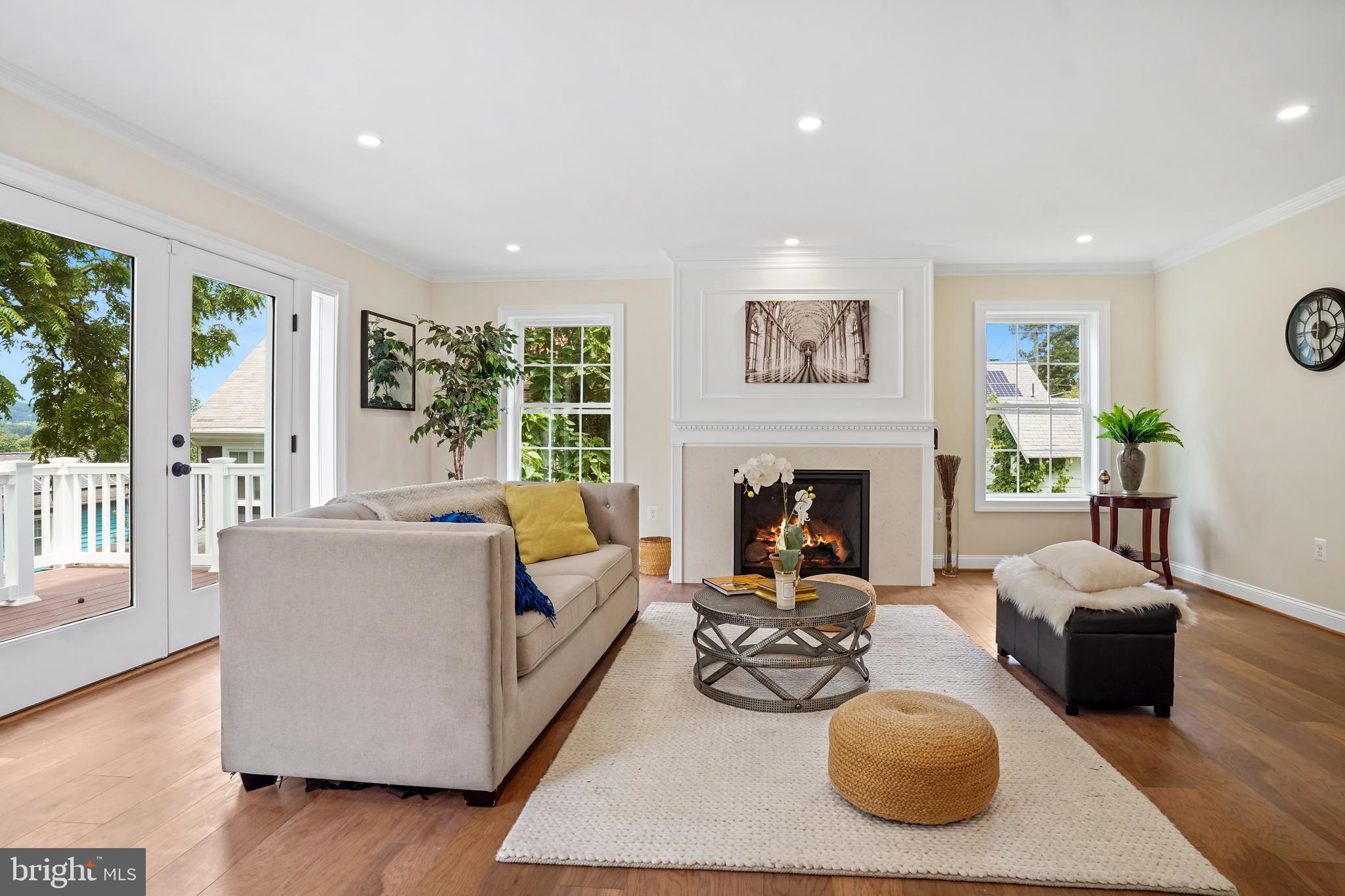 3722 13th Street Northeast Washington, DC 20017 - Photo 16 of 50 a living room with furniture couches and a fireplace