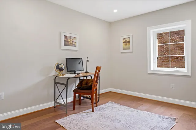 a workspace with furniture and window