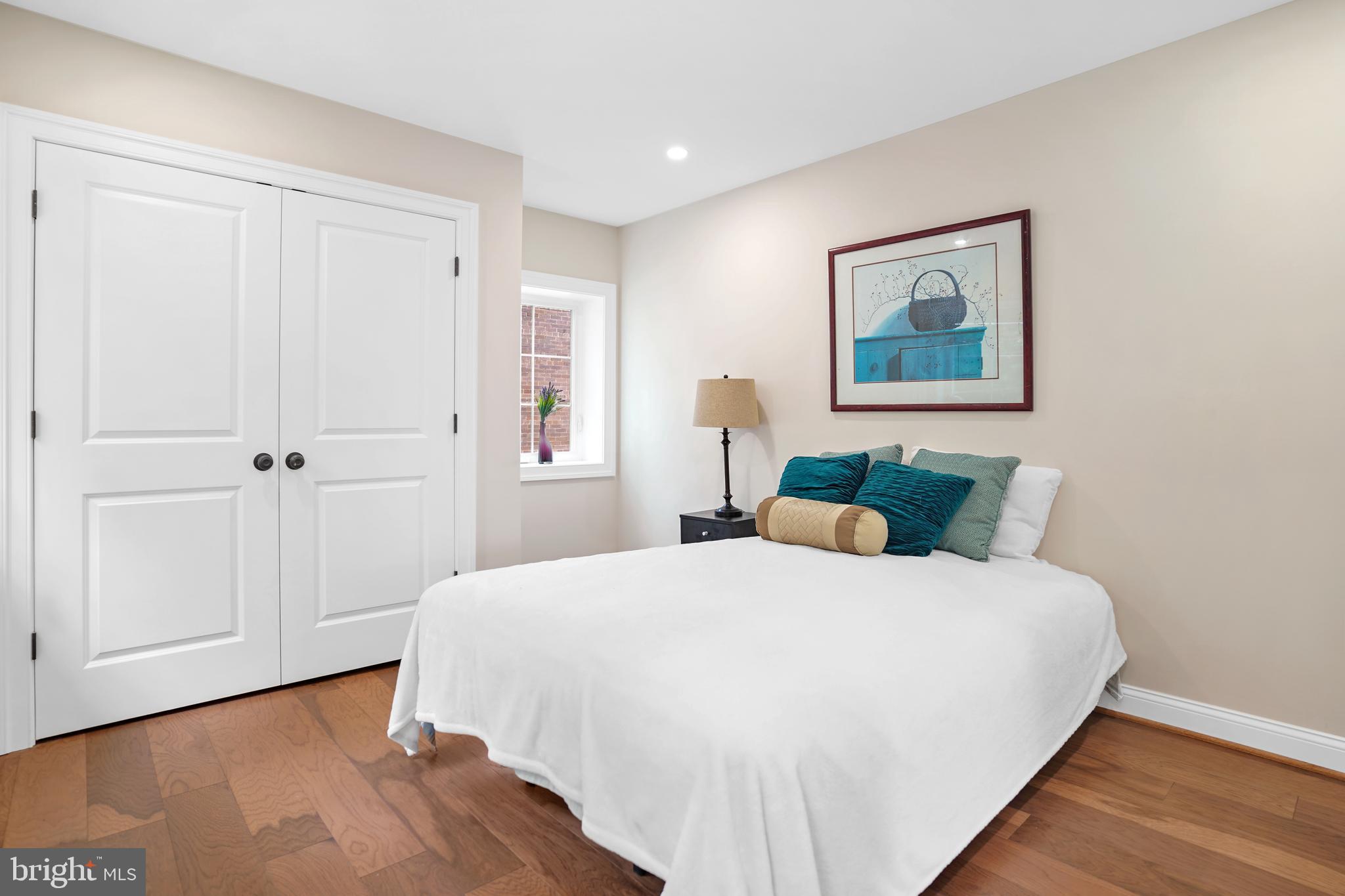 3722 13th Street Northeast Washington, DC 20017 - Photo 23 of 50 a bedroom with a bed and a painting on the wall