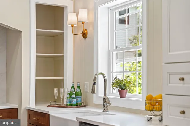 a kitchen with a stove and a sink