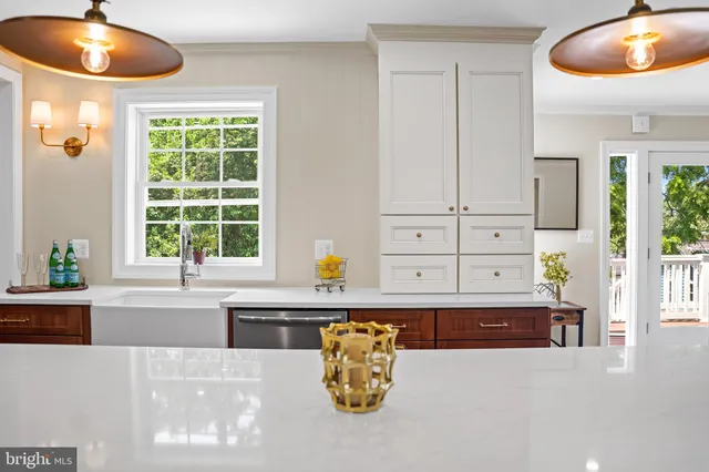 a living room with a fireplace and a window