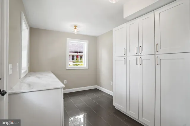 a bathroom with a sink and a window