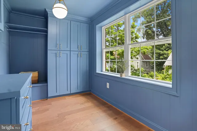 a view of a kitchen with a sink a fireplace and a window